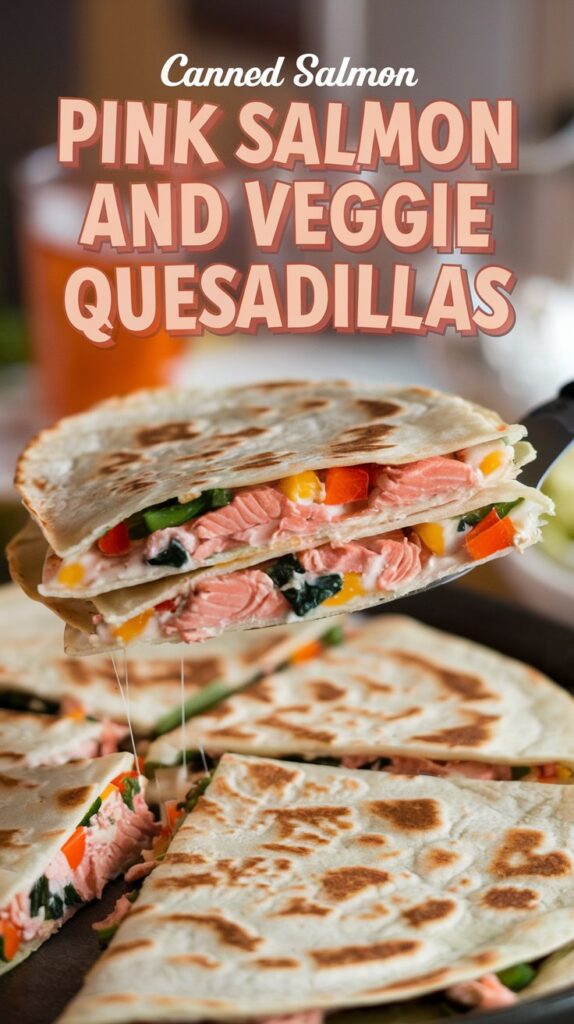 Close-up of a quesadilla revealing its cheesy salmon and veggie-packed interior as it is lifted by a spatula. The text "Canned Salmon Pink Salmon and Veggie Quesadillas" features in a playful font against a casual family dinner table setting.
