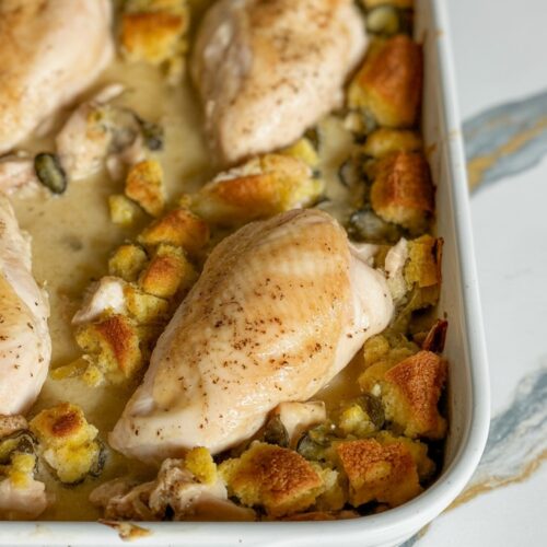 Baked chicken and stuffing casserole made with boneless, skinless chicken breasts, creamy sauce, and golden stuffing topping.