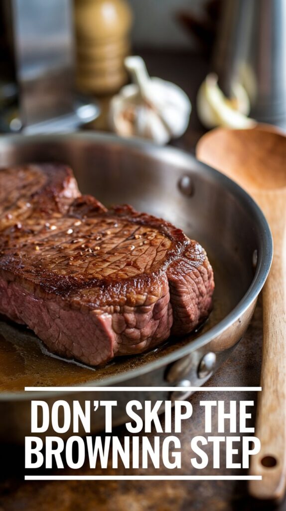 Browning steak in a frying pan with text "don't skip the browning step"