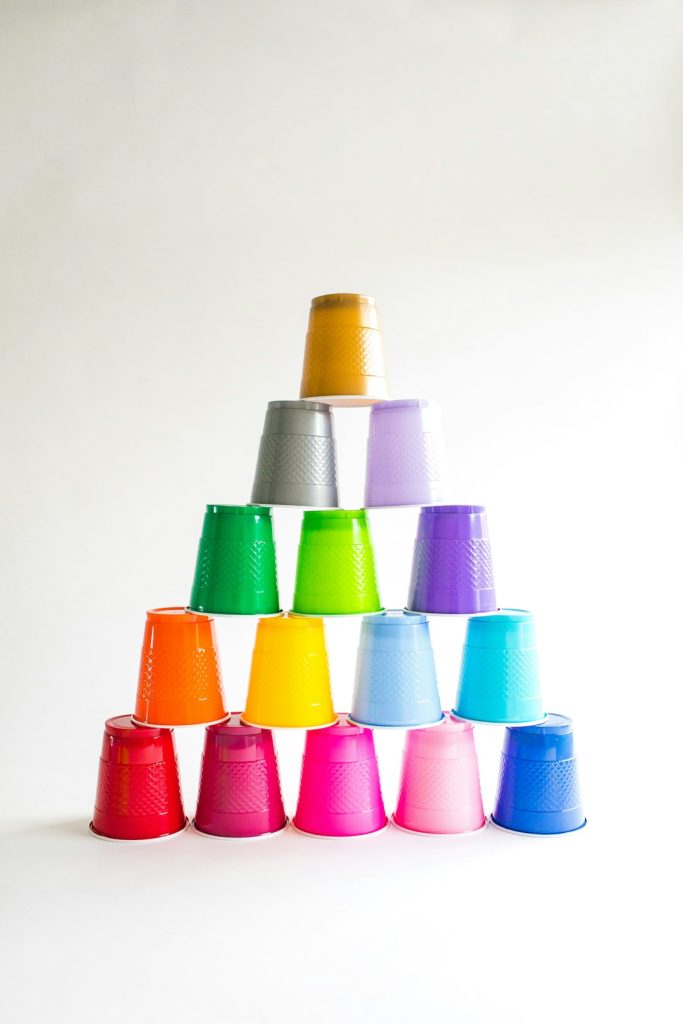 Colorful plastic cups stacked into a pyramid